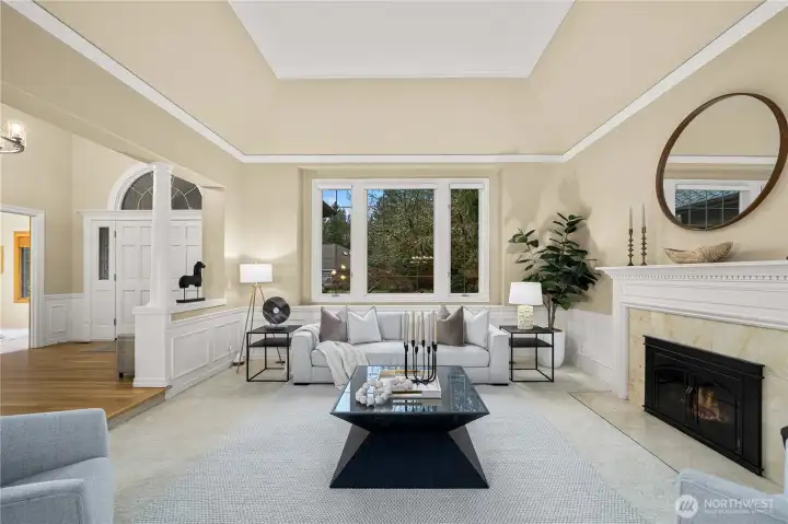 Light-filled space with a central fireplace, offering a warm yet refined setting for both entertaining and quiet everyday living.