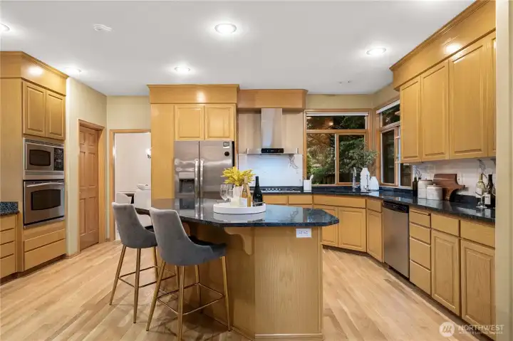 Gourmet kitchen with seamless flow to dining and family room