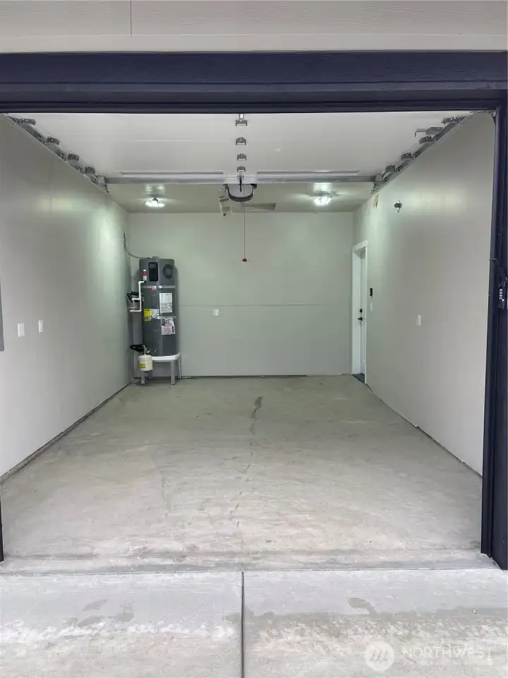 Good size garage has garage door opener.