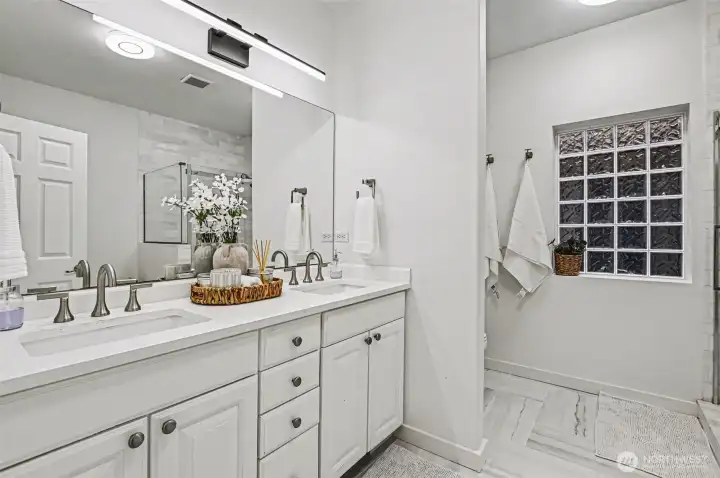 Primary Bath with new quartz counters and refinished cabinets.