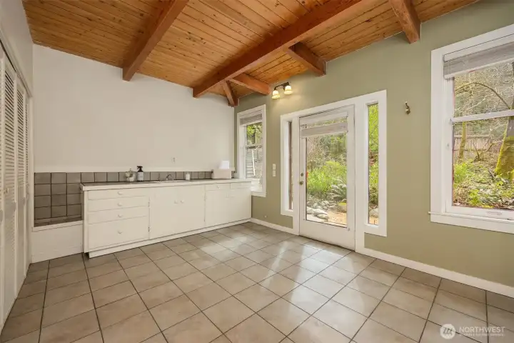 Versatile laundry/utility room on the main level - potential for a creative work space or studio.