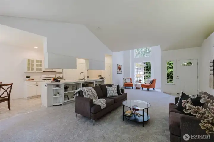 Open concept and vaulted ceilings offer an airy feel.