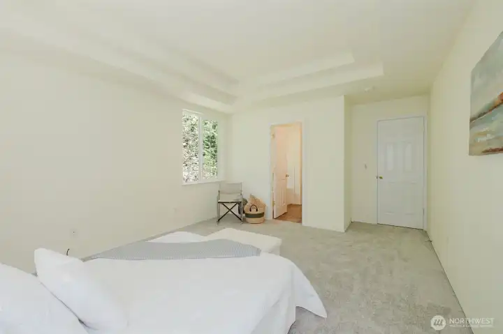 Primary bedroom leads to ensuite bath and walk in closet