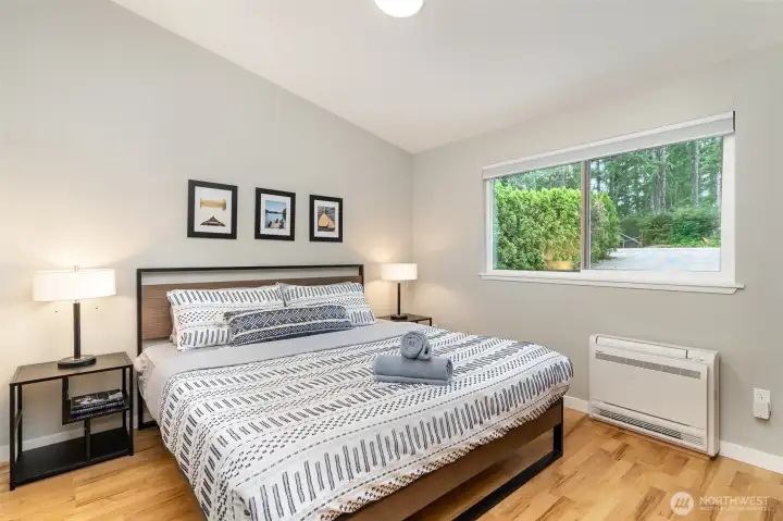 Main floor king-sized bedroom (triple pane window and full closet wall.