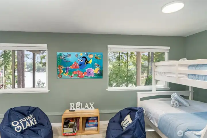 Walls of windows downstairs take in gorgeous views and lots of light!