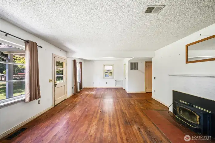 Original hardwood flooring, cozy wood burning stove