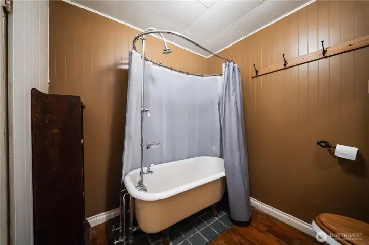 Main floor bath with charming vintage clawfoot tub