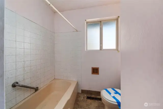 Full bathroom with tiled floors