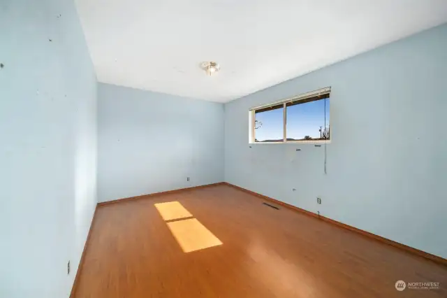 2nd bedroom is large and cheery with laminate flooring and large view window!