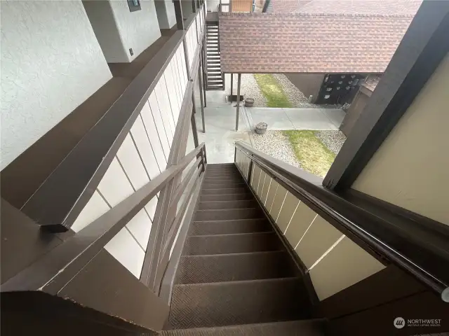 Stairs leading from main level to second floor entry.