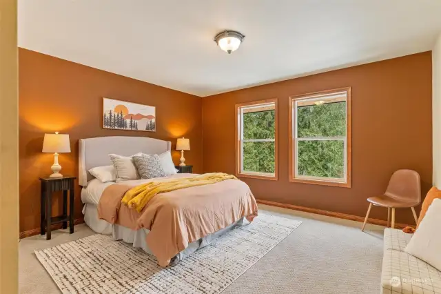 3rd bedroom w/a plush carpeting, a neutral color palette, and ample space.