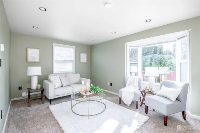 The family room is a fantastic addition to the home. It has so much light and a lovely bay window.