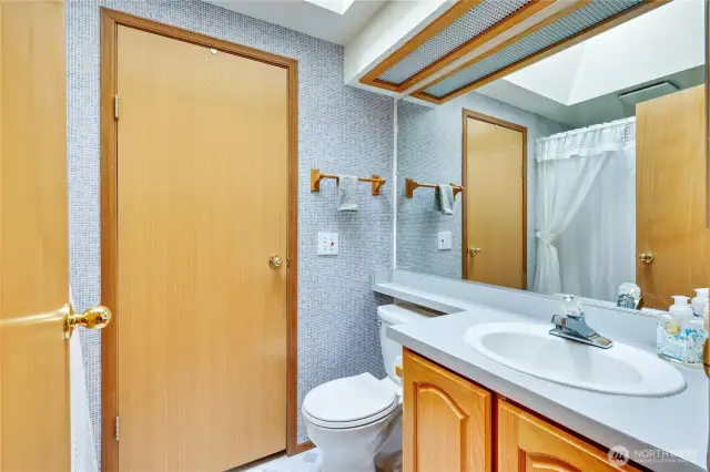 Full bath in hallway, Laundry room thru the door.