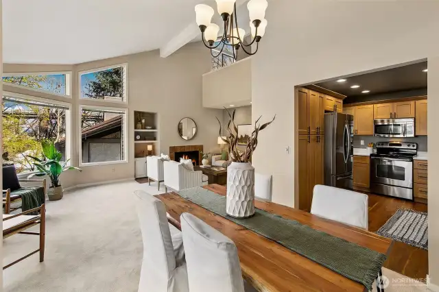 Two stories with vaulted ceilings and huge windows overlooking the trees.