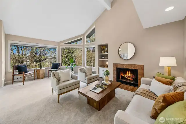 Cozy fireplace anchors the living and feels like a lodge or chalet.