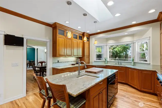 Central island includes a prep sink and second dishwasher