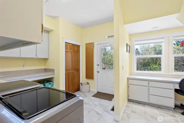 Large laundry room with utility sink off kitchen