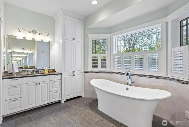 Updated primary bathroom with soaking tub and heated floors