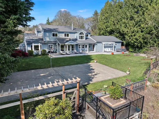 Sprawling back yard with sport court