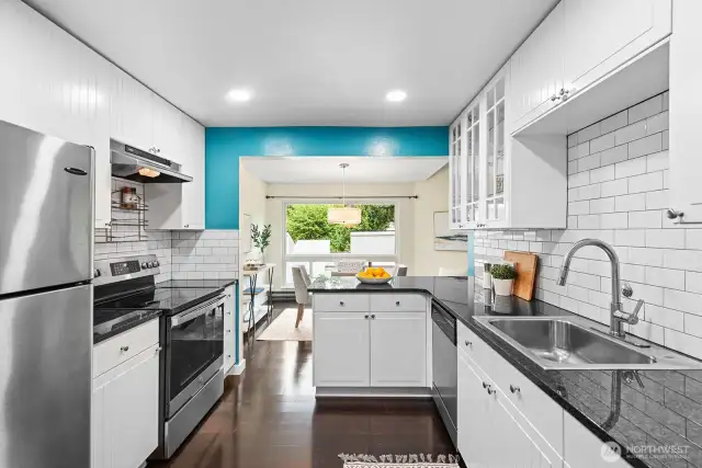 Kitchen with subway tile, stainless appliances, and quartz counter top