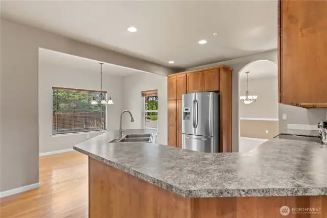 Kitchen with dining nook to patio. Spaces to entertain inside to outdoor bar-b-que.