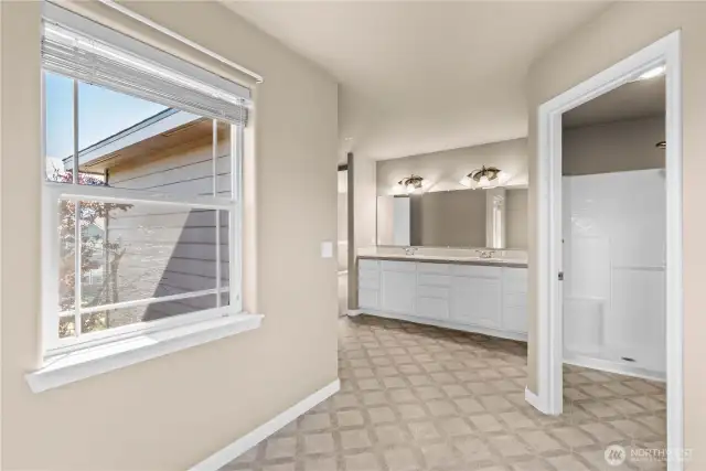 Primary en-suite bath, double vanity, walk-in shower, bathtub, linen closet