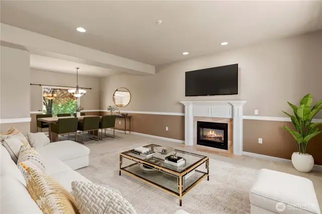 Living room with fireplace to dining room