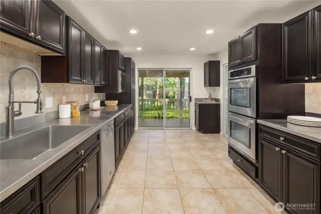 Newer kitchen, opens onto backyard