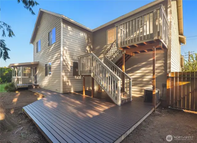 Separate entrance to primary suite with extra wide deck stairs