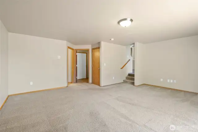 Family room, looking towards garage entry, laundry room and 1/2 bath