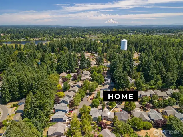 Home is nestled in the tree-lined community of Whisper Ridge
