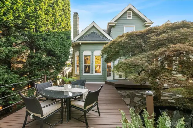 just imagine your favorite beverage, here, on this perfect deck, next to this perfect pond/fountain, as you unwind.   this private oasis is a rare in Seattle.  You found it, welcome home.
