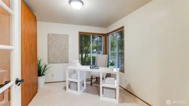 The main floor den with installed Murphy bed can be used well as a guest room.