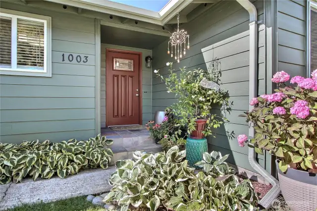 Welcoming front porch and newer door! Newer outer paint as well,