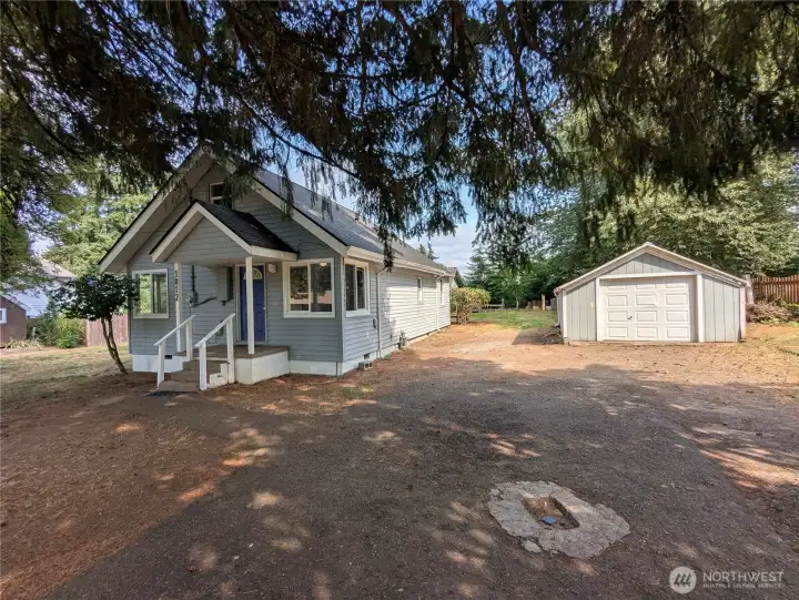 Large driveway and one car garage with plenty of room for parking a trailer.