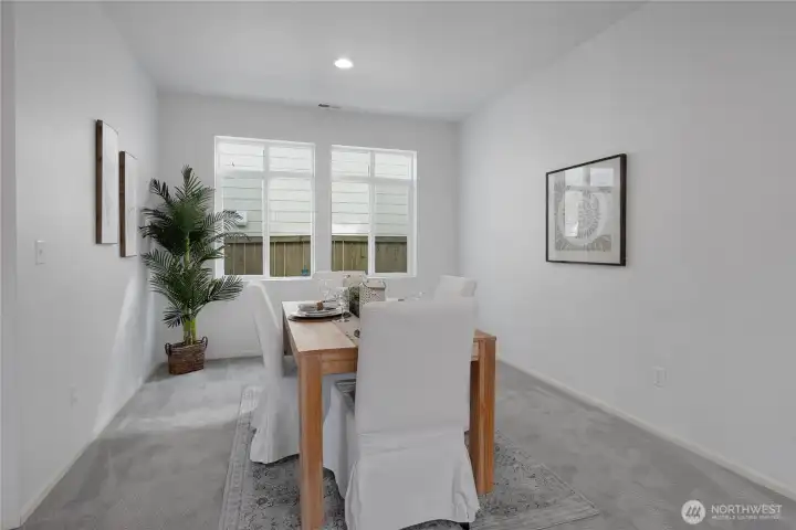 The formal Dining Room also has large windows.