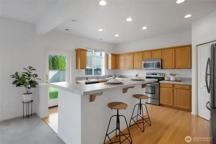 The kitchen has a large island with Breakfast Seating.