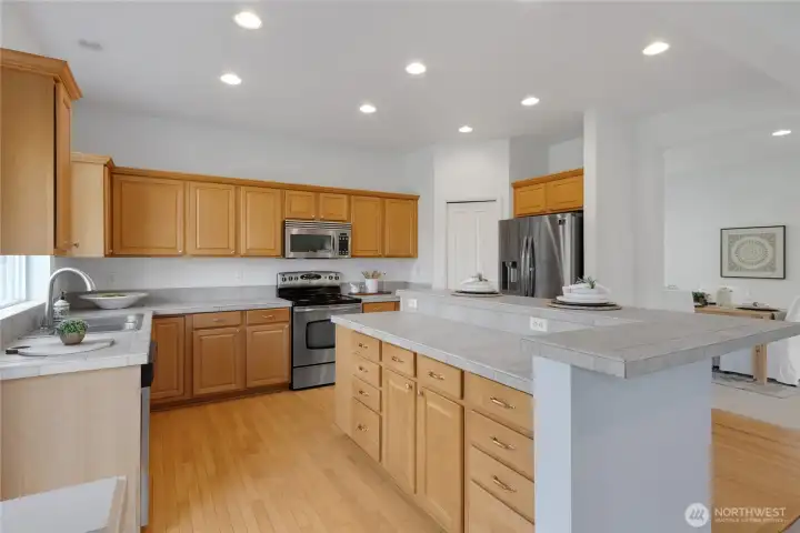 This view shows the abundance of counter space & the pantry in the corner of the kitchen.