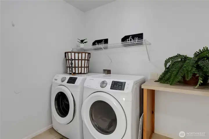 The generous laundry room is upstairs close to all of the bedrooms.