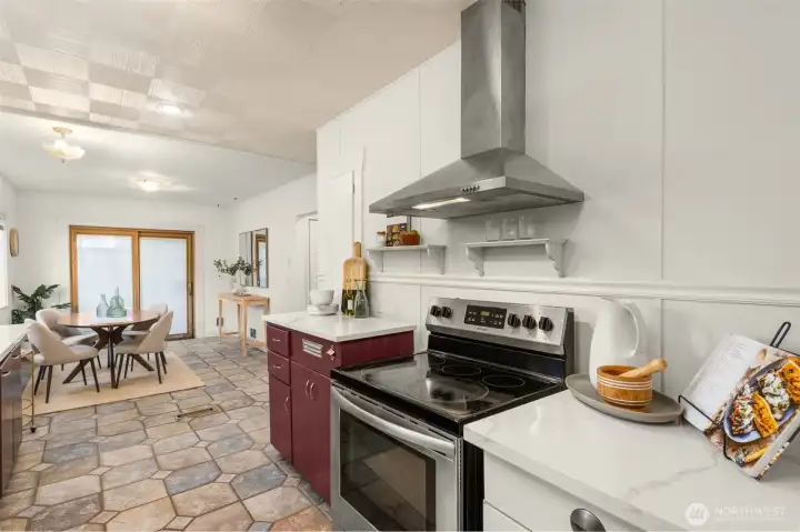 A stainless steel hood vent over stove was installed to keep the kitchen feeling fresh