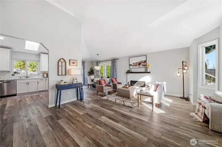 Open & airy main living room w/ bay window.