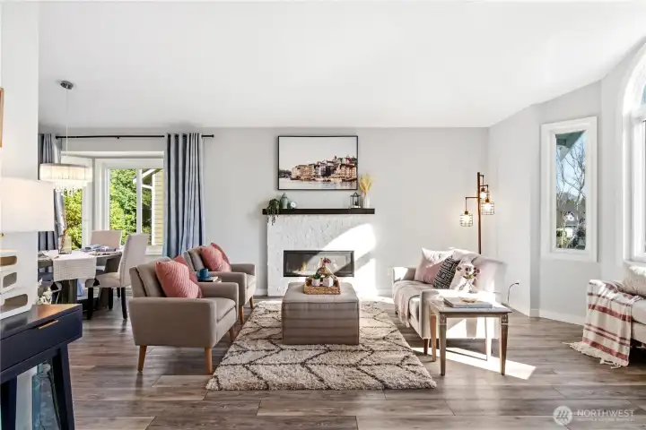 Centerpiece gas fireplace w/ custom stone surround.