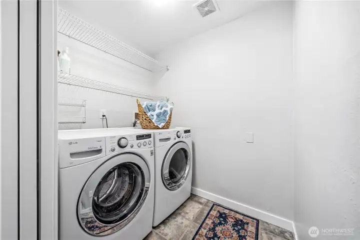 Large laundry room with washer & dryer that stay with the home.