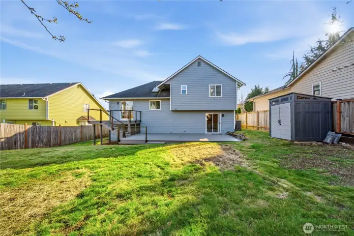 Large level backyard with storage shed for all your lawn & gardening equipment.