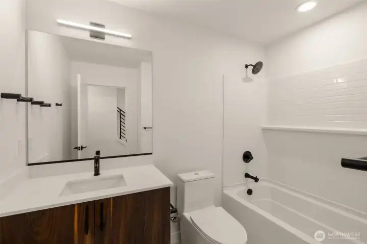 High-quality finishes continue into the guest bathrooms for a cohesive look