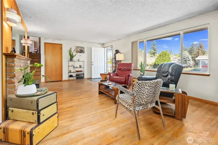 Original oak floors and large front window make for a bright feel.