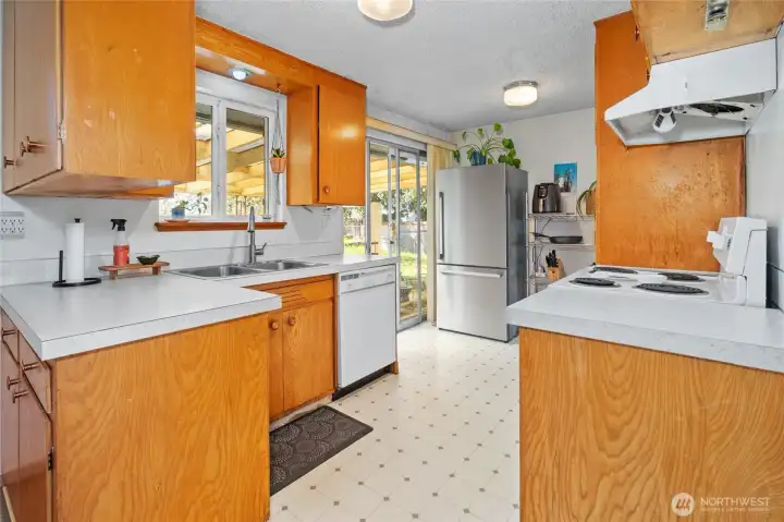 Kitchen walk-through from dining area.