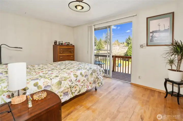 Primary bedroom has private east-facing deck.