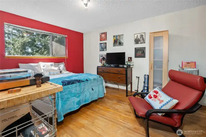 Bedroom #3 on upper level, overlooking backyard.