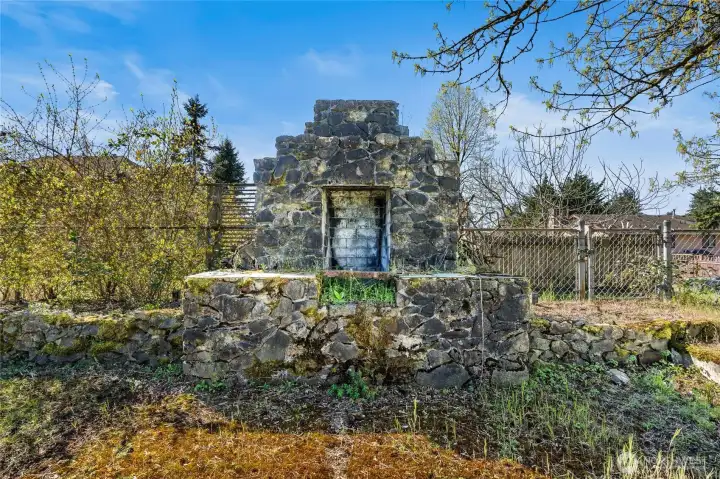 Functional outdoor fireplace invites you to design around it.